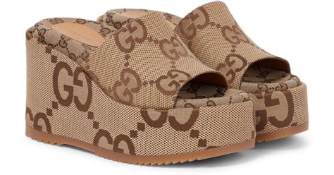 Gucci: Brown GG Platform Sandals 